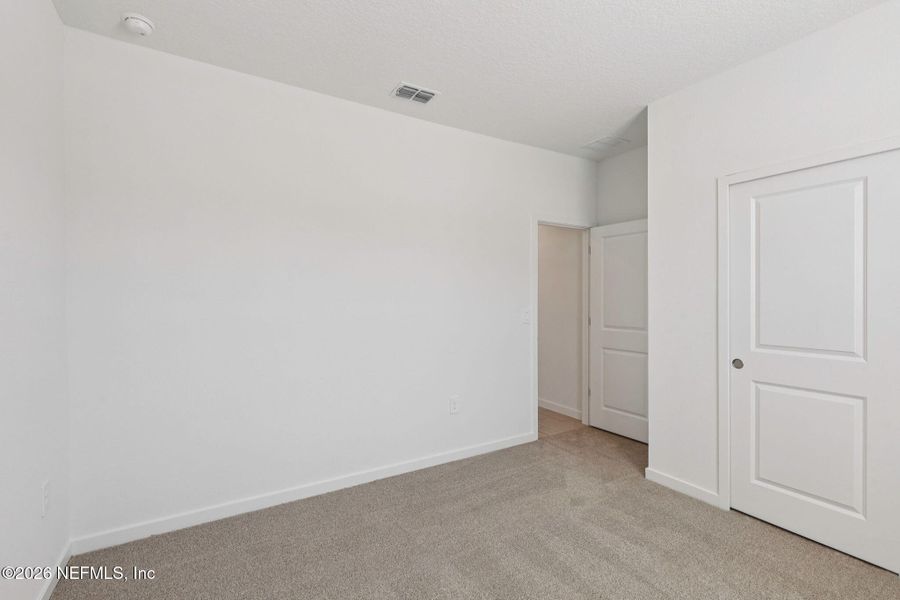 Spacious, unfurnished interior of a new home in Lakes at Bella Lago - Signature Series, Green Cove Springs (Image 27).