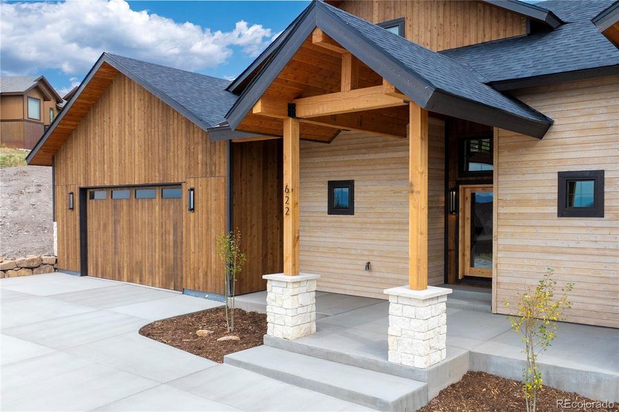 Front exterior of a new home in , Granby, CO, highlighting curb appeal (Image 30).