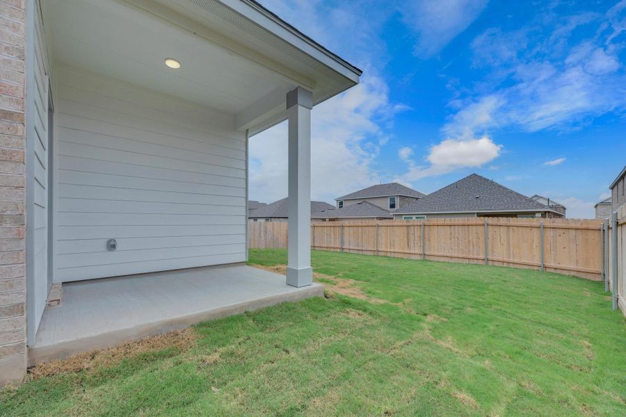 Front exterior of a new home in Salerno - Heritage Collection, Round Rock, TX, highlighting curb appeal (Image 19). Front exterior of a new home in Salerno - Heritage Collection, Round Rock, TX, highlighting curb appeal (Image 19).