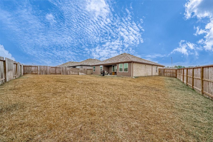Exterior details and patio area of a home in Mill Creek, Magnolia (Image 25).