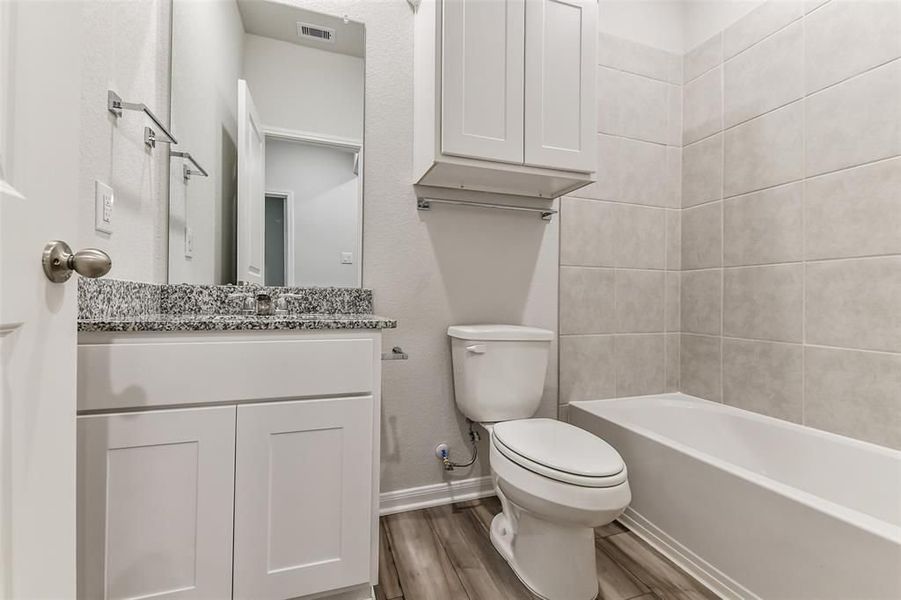 Furnished interior view inside a new home in Caney Creek Place, Conroe (Image 52).