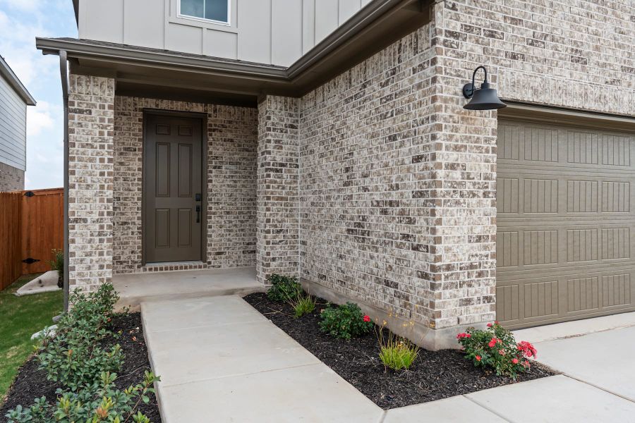 Exterior details and patio area of a home in Lariat, Liberty Hill (Image 23).