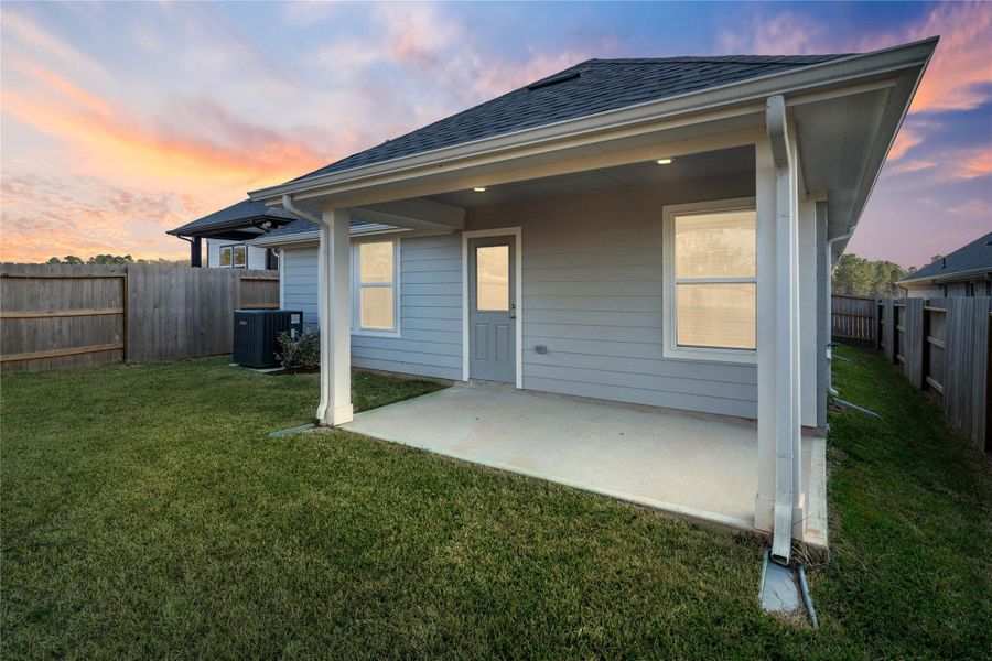 The spacious covered patio offers a tranquil outdoor retreat, perfectly designed for savoring your quiet morning coffee or unwinding during peaceful evening relaxation.