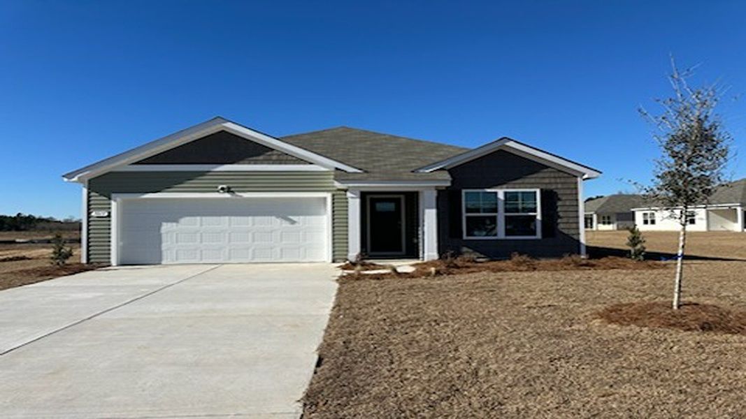 Front exterior of a new home in Jordanville Farms, Galivants Ferry, SC, highlighting curb appeal (Image 1). Front exterior of a new home in Jordanville Farms, Galivants Ferry, SC, highlighting curb appeal (Image 1).