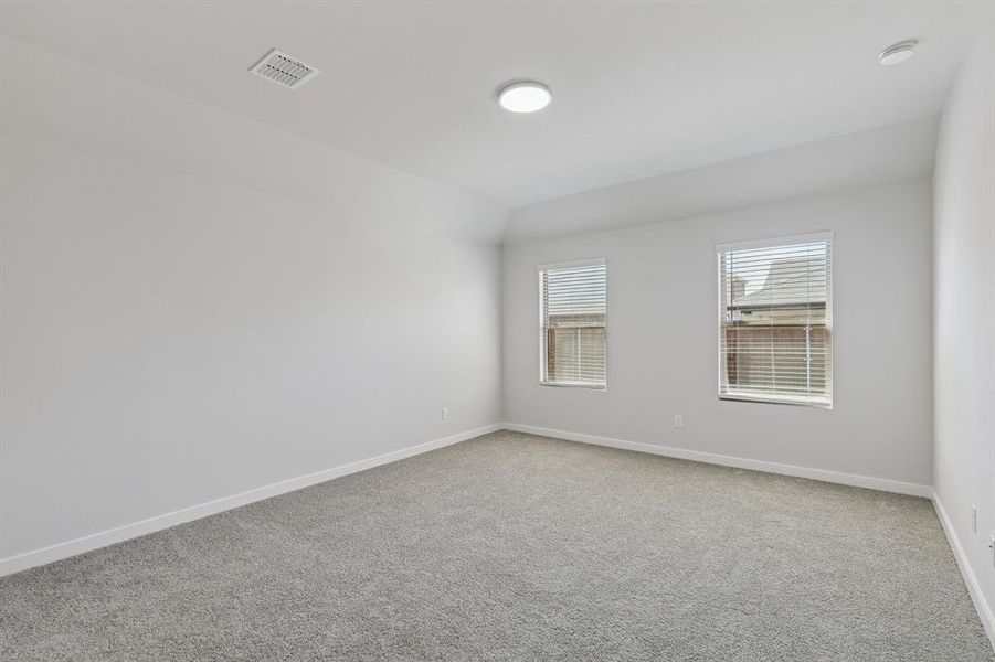 Primary Suite in the Harrison home plan by Trophy Signature Homes – REPRESENTATIVE PHOTO