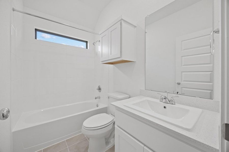 Bathroom in the Cypress home plan by Trophy Signature Homes – REPRESENTATIVE PHOTO