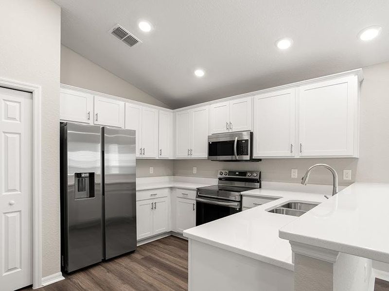 Your bright, beautifully-designed kitchen includes quartz, 36-inch cabinets, Samsung SS appliances, and a pantry. Your bright, beautifully-designed kitchen includes quartz, 36-inch cabinets, Samsung SS appliances, and a pantry.