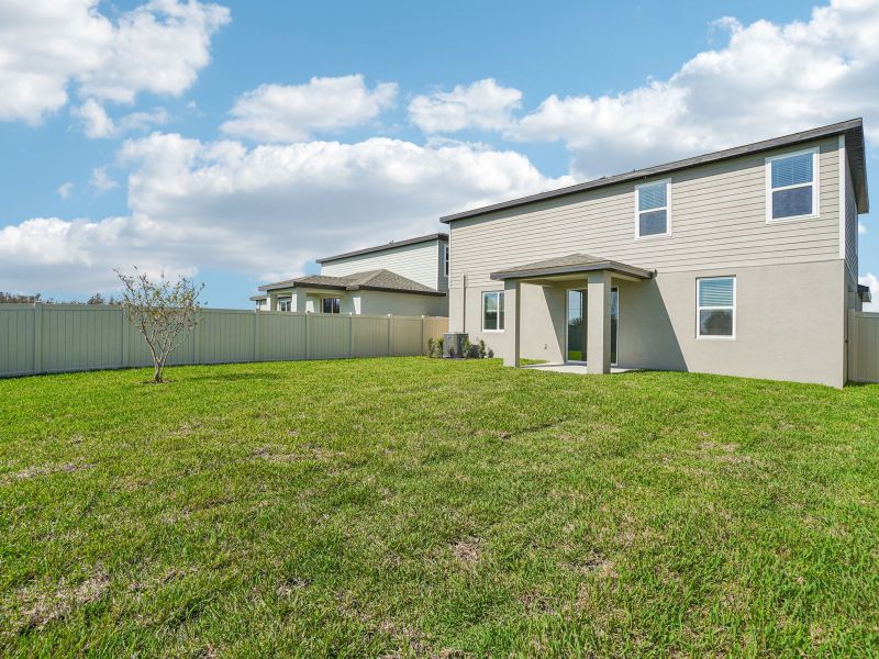 Exterior details and patio area of a home in Two Rivers - Classic Series, Zephyrhills (Image 4).