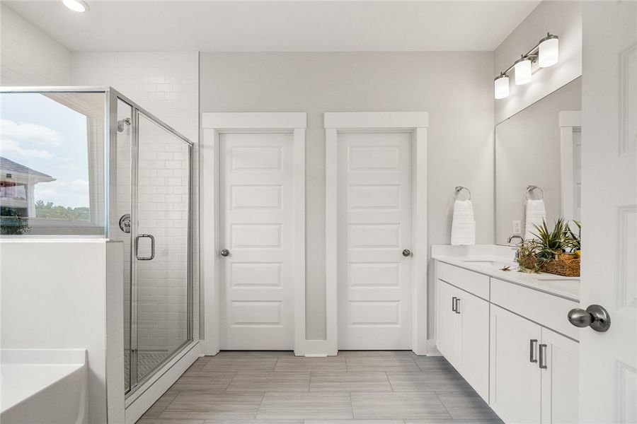 White subway tile lines the shower, complementing White subway tile lines the shower, complementing