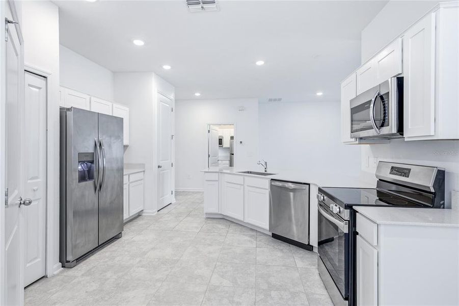 Furnished interior view inside a new home in Peace Creek Reserve, Winter Haven (Image 12).