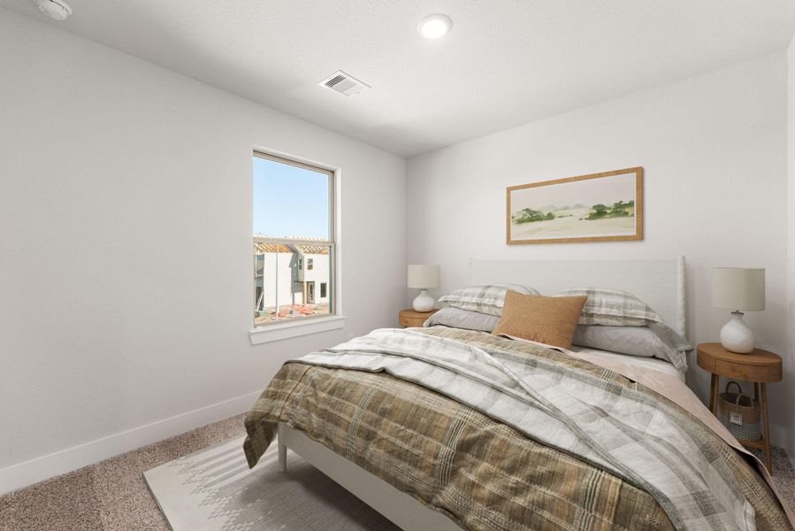 This secondary bedroom offers a bright and inviting space with neutral tones and a large window that fills the room with natural light, an ideal retreat for guests or family. This secondary bedroom offers a bright and inviting space with neutral tones and a large window that fills the room with natural light, an ideal retreat for guests or family.