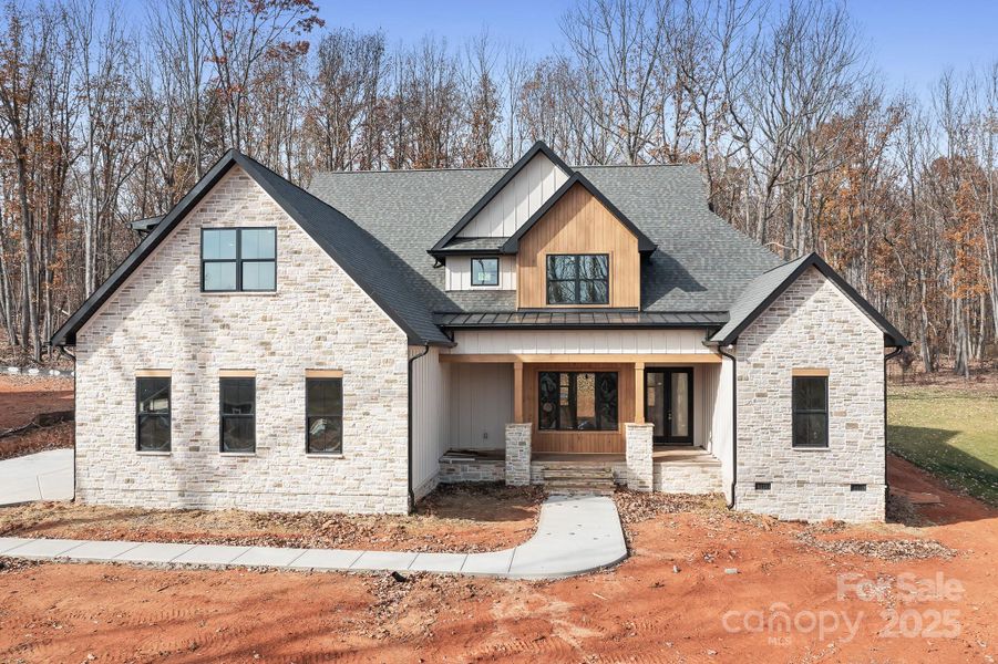 Welcome Home!  Framed by a rocking-chair front porch, this home offers timeless architectural charm.