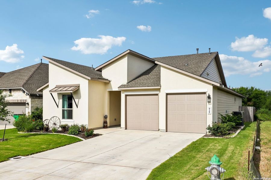 Front exterior of a new home in Nolte Farms, Seguin, TX, highlighting curb appeal (Image 22). Front exterior of a new home in Nolte Farms, Seguin, TX, highlighting curb appeal (Image 22).