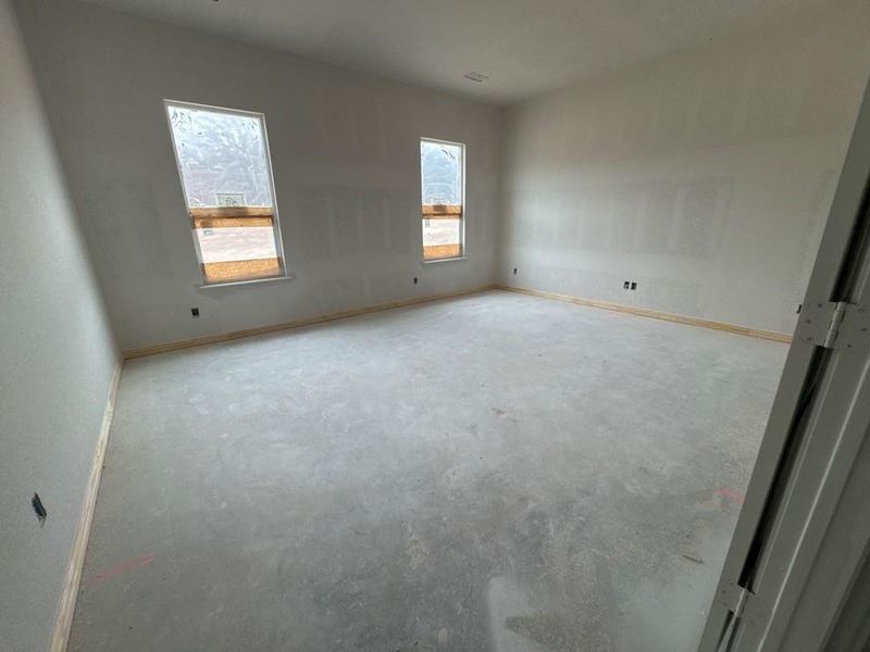 Unfurnished room featuring baseboards