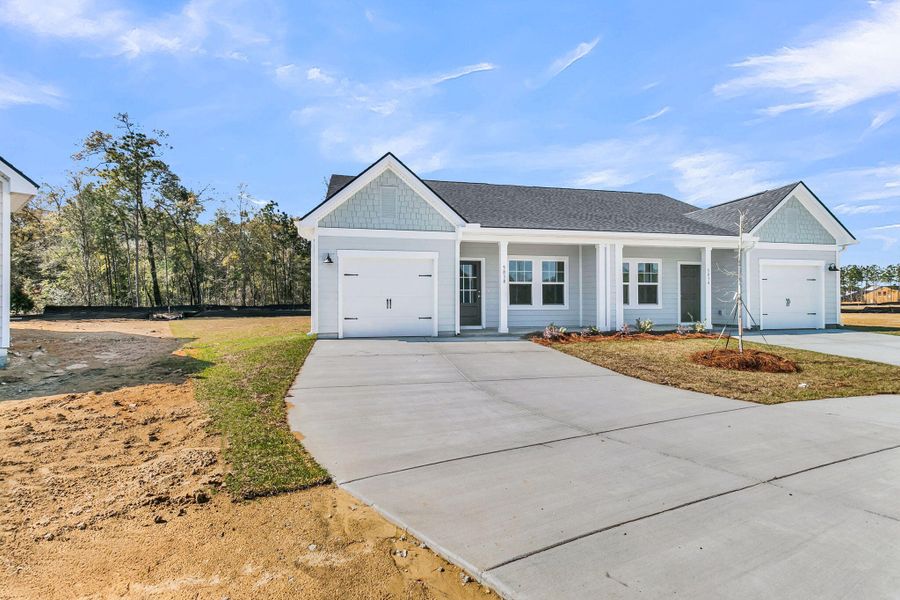 Front exterior of a new home in , Ravenel, SC, highlighting curb appeal (Image 17).