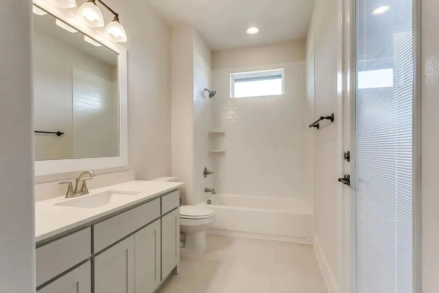 Representative furnished interior of a home built from the The Carter by Elmwood Custom Homes in Ranch at Stone Hill, Waxahachie (Image 10).