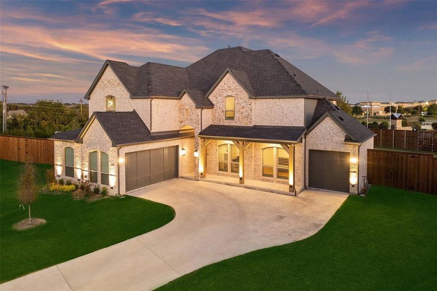 Front exterior of a new home in Cambridge Estates, Prosper, TX, highlighting curb appeal (Image 2). Front exterior of a new home in Cambridge Estates, Prosper, TX, highlighting curb appeal (Image 2).