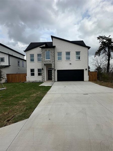 Front exterior of a new home in , Dallas, TX, highlighting curb appeal (Image 14).