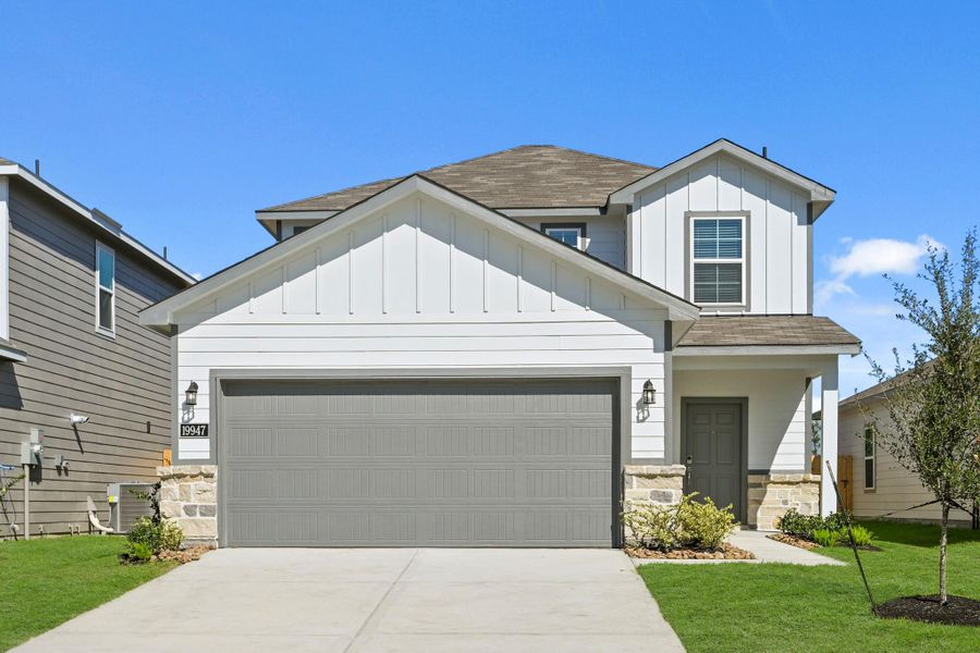 Front exterior of a new home in Northpark South, Porter, TX, highlighting curb appeal (Image 18). Front exterior of a new home in Northpark South, Porter, TX, highlighting curb appeal (Image 18).