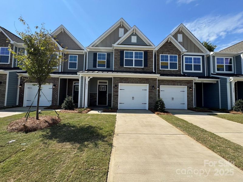 Front exterior of a new home in Harrisburg Village, Harrisburg, NC, highlighting curb appeal (Image 1).