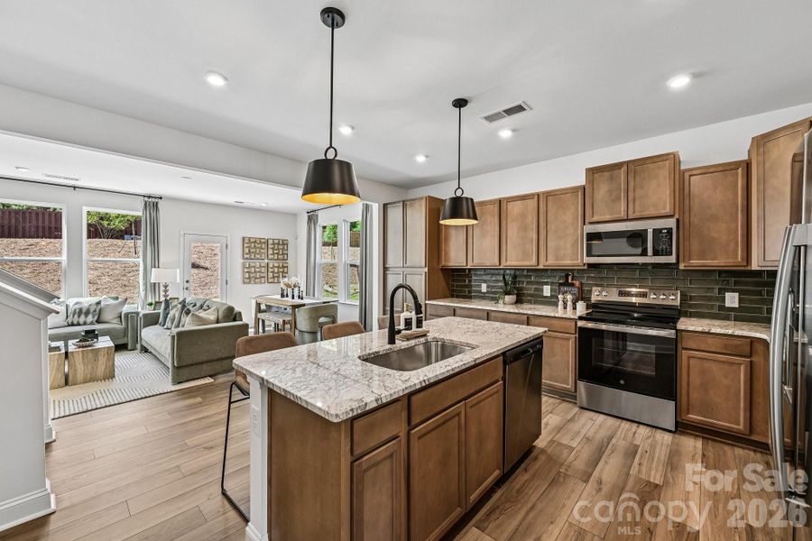 Model Home - Open Floor Plan, Living, Kitchen & Dining Area. Model Home - Open Floor Plan, Living, Kitchen & Dining Area.
