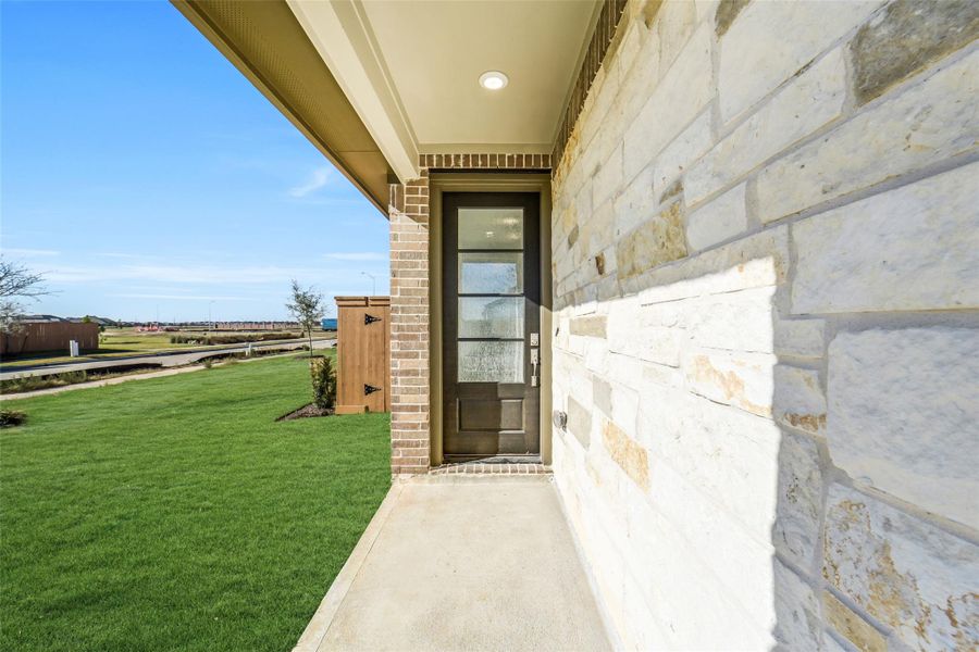 Exterior details and patio area of a home in Sunterra, Katy (Image 4).