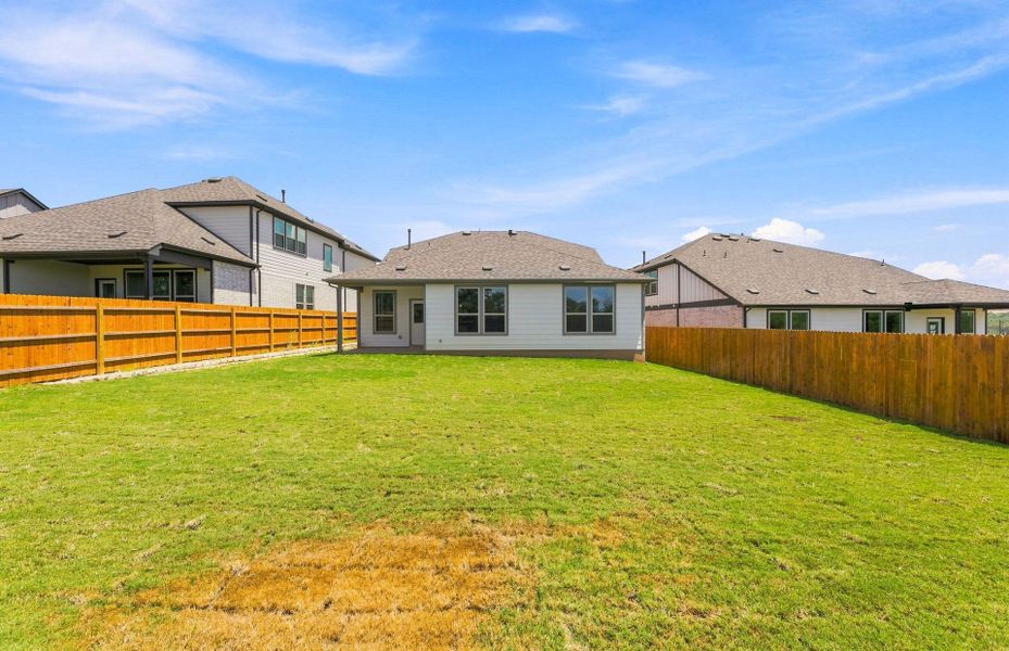 Exterior details and patio area of a home in Saddleback at Santa Rita Ranch, Liberty Hill (Image 25).