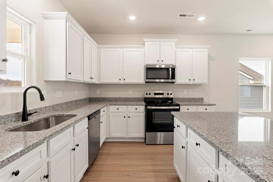 Furnished interior in a model home at Stagecoach Station in Gastonia (Image 16).