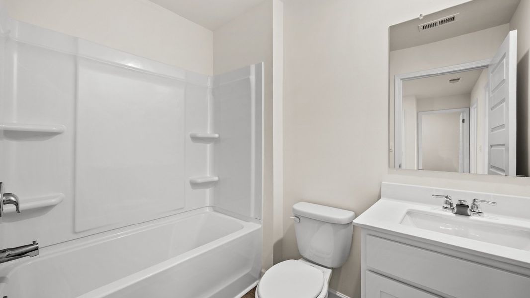 Representative furnished interior of a home built from the Salisbury by D.R. Horton in Inverness at Sugarloaf, Lawrenceville (Image 9).