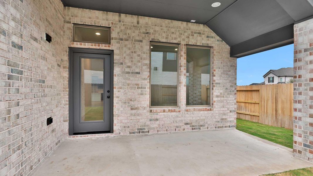 Exterior details and patio area of a home in Brookewater 40', Rosenberg (Image 3).