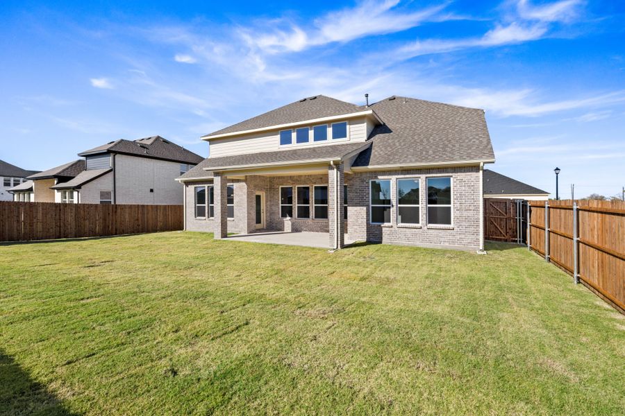 Exterior details and patio area of a home in Lake Breeze, Lavon (Image 4).