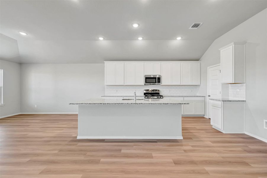 Furnished interior view inside a new home in Carillon, Manor (Image 5).