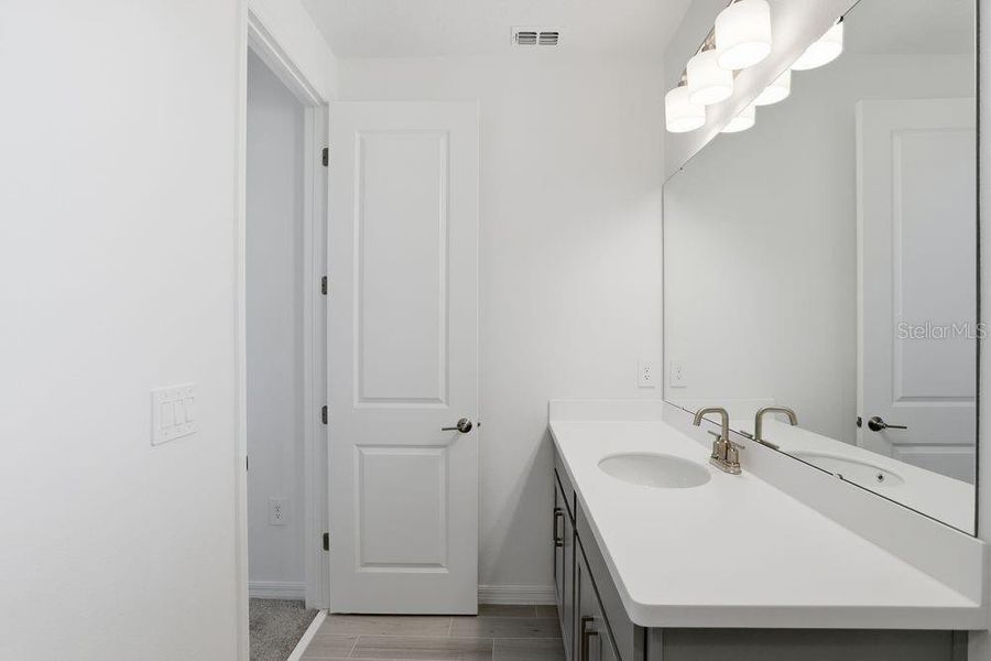 Furnished interior view inside a new home in Harvest at Ovation, Winter Garden (Image 11).