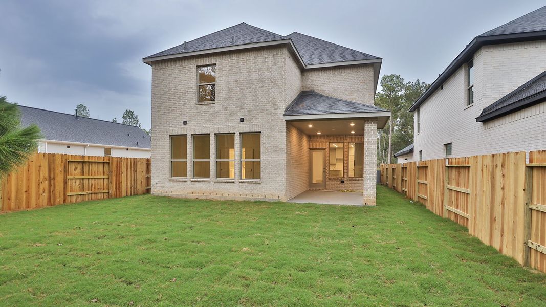 Exterior details and patio area of a home in Woodhavyn 40', Magnolia (Image 3).