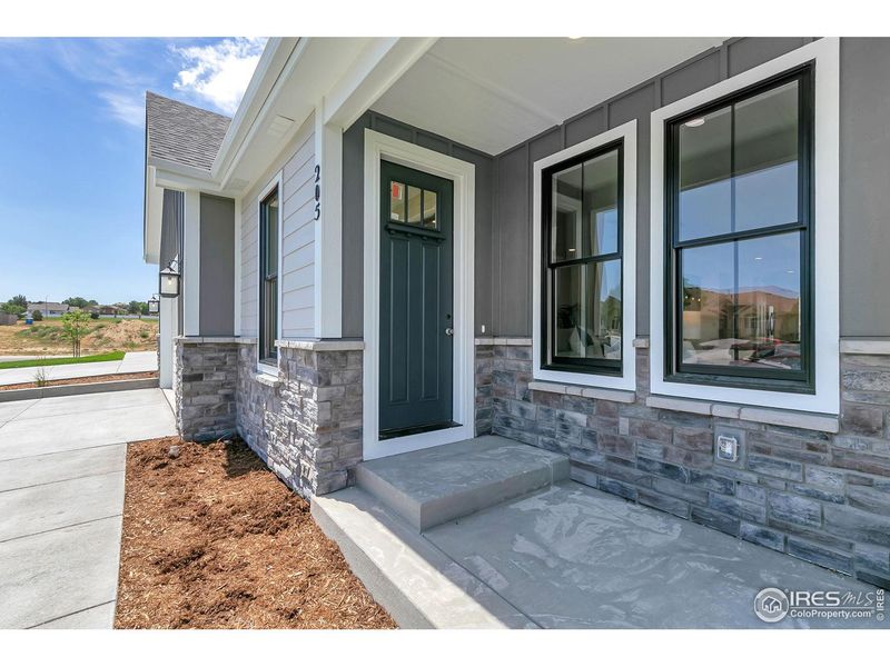 Exterior details and patio area of a home in Cottages at Kelly Farm, Greeley (Image 27).