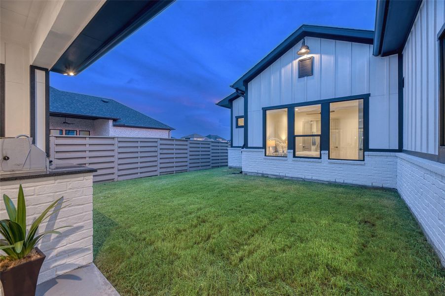 Yard space off the huge covered patio and outdoor kitchen. Yard space off the huge covered patio and outdoor kitchen.