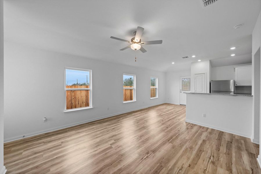 Enjoy a bright sprawling family room, open to the dining room and kitchen, creating the ideal space for entertaining.