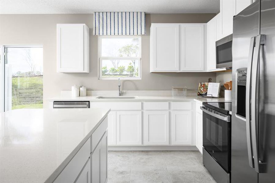 Representative furnished interior of a home built from the Piper End Unit by Ryan Homes in Terra Lago Townhomes, Indiantown (Image 3).