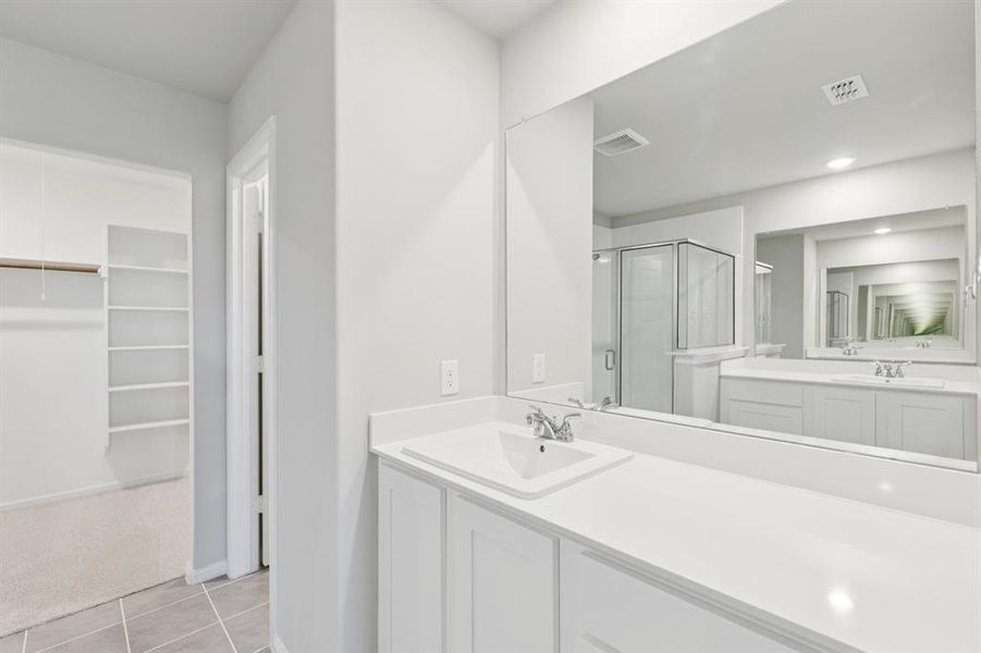 Primary Bathroom in the Harrison home plan by Trophy Signature Homes – REPRESENTATIVE PHOTO Primary Bathroom in the Harrison home plan by Trophy Signature Homes – REPRESENTATIVE PHOTO