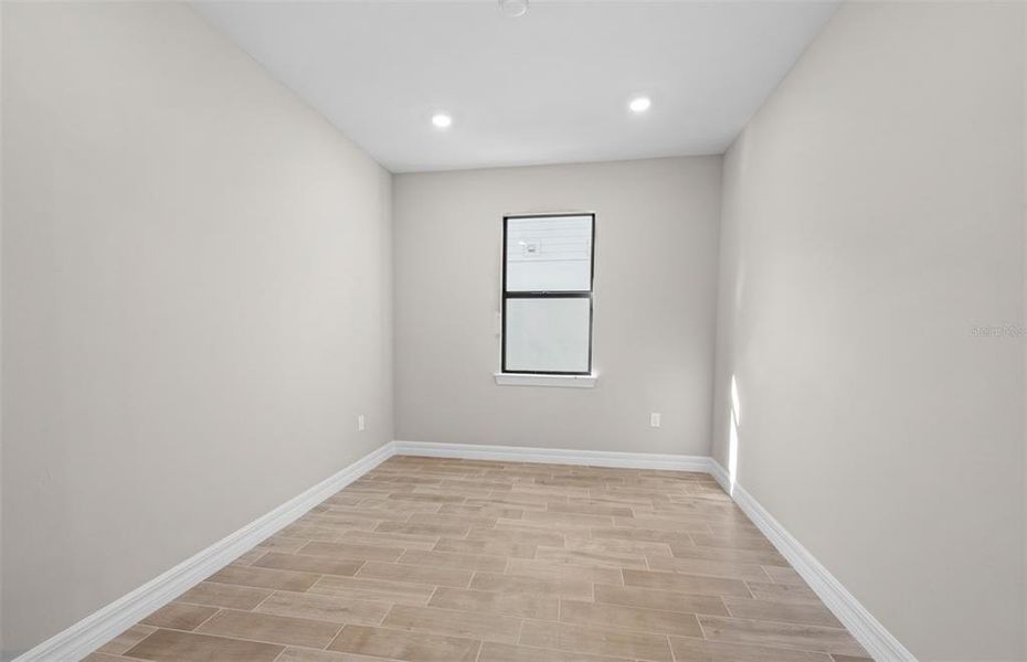 Spacious, unfurnished interior of a new home in Cedar Grove at The Woodlands, North Port (Image 25).