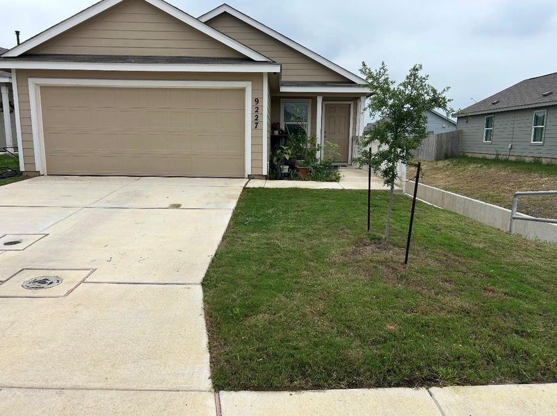 Front exterior of a new home in Navarro Ranch, Seguin, TX, highlighting curb appeal (Image 2). Front exterior of a new home in Navarro Ranch, Seguin, TX, highlighting curb appeal (Image 2).