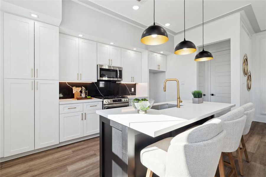 Sleek quartz countertops and premium finishes define this chef-inspired kitchen.