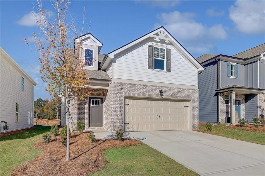 Front exterior of a new home in Abbotts Crossing, Conyers, GA, highlighting curb appeal (Image 15).