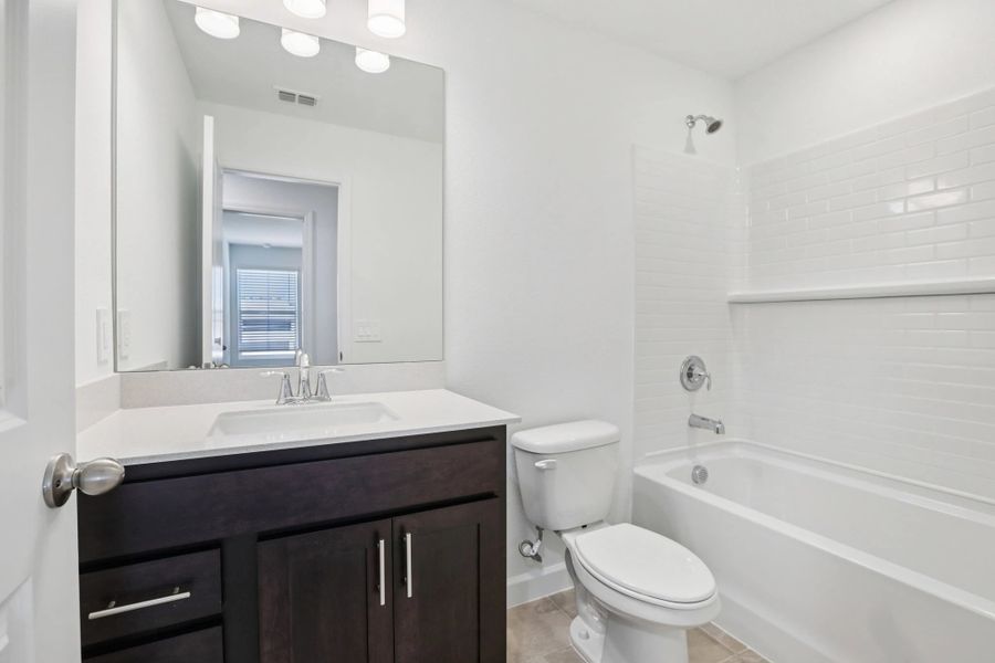 Elegant 2nd bathroom with shower and tub combo