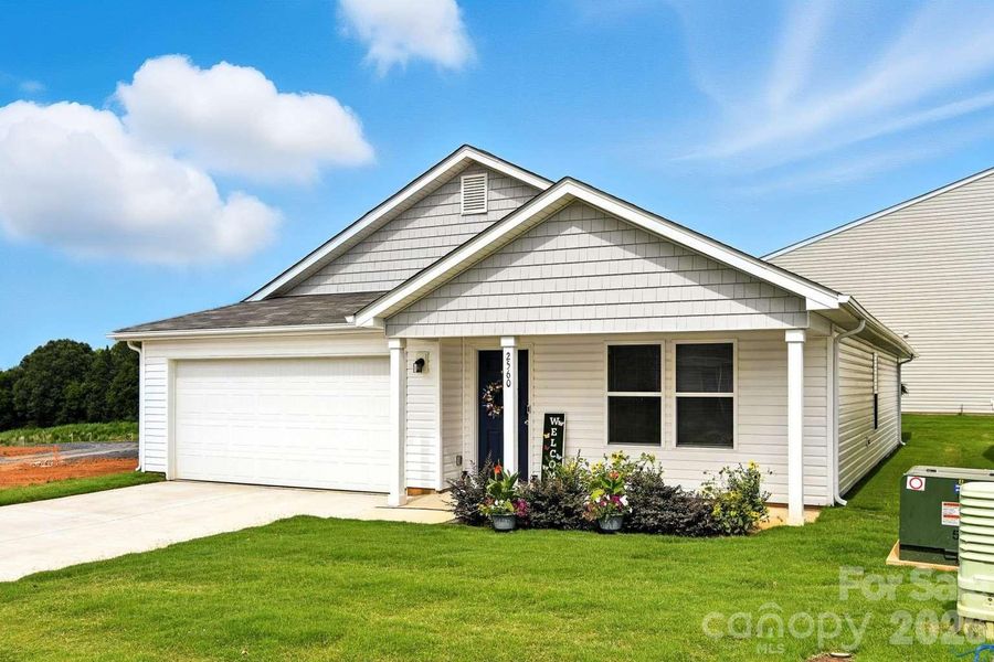 Front exterior of a new home in Trivium, Newton, NC, highlighting curb appeal (Image 21).