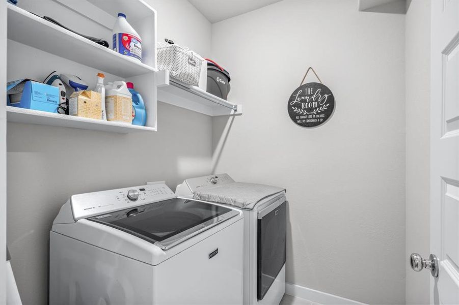 Clothes washing area with washer and clothes dryer