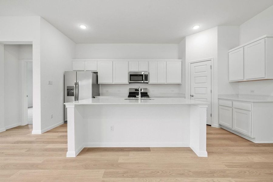 Kitchen in the Quartz home plan by Trophy Signature Homes – REPRESENTATIVE PHOTO Kitchen in the Quartz home plan by Trophy Signature Homes – REPRESENTATIVE PHOTO