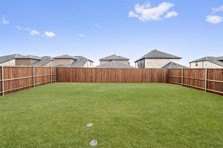 View of yard with a fenced backyard