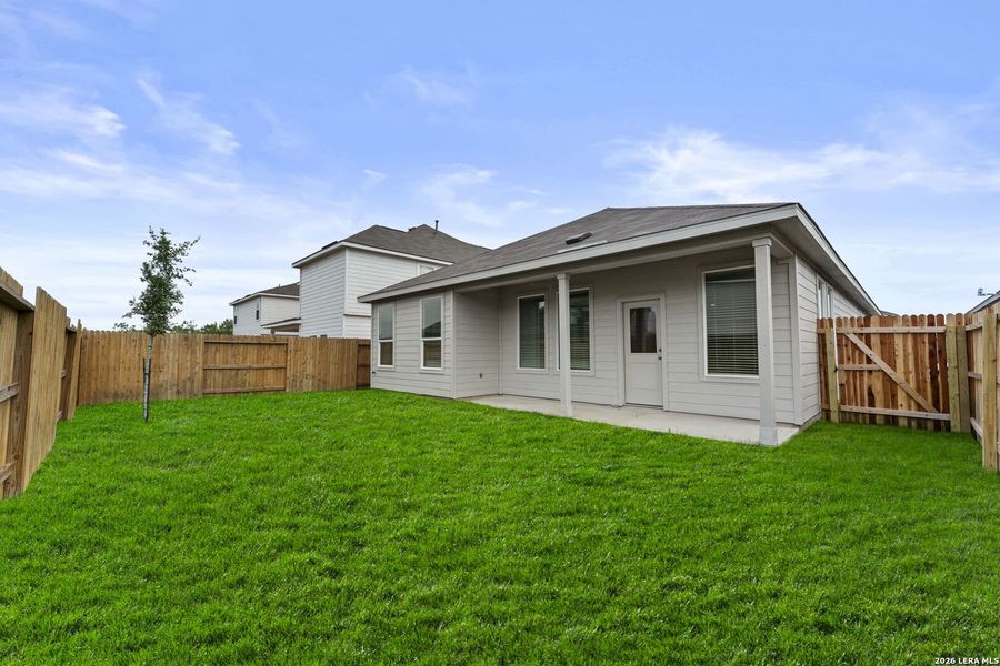 Exterior details and patio area of a home in Hightop Ridge, Converse (Image 2).