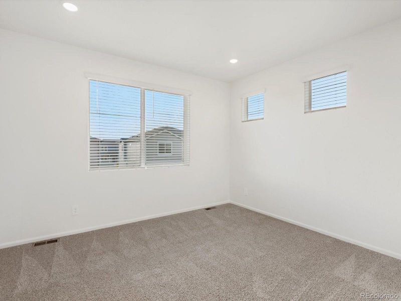 Spacious, unfurnished interior of a new home in Buffalo Highlands: The Flora Collection, Commerce City (Image 13).